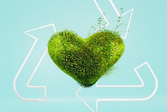 Symbolbild für Nachhaltigkeit Herz aus Gras, umgeben von Kreislaufwirtschaft-Symbolen auf blauem Hintergrund.